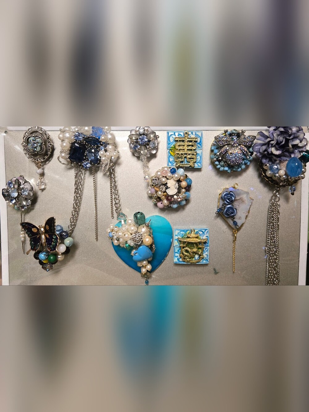 handmade refrigerator magnets made from vintage jewelry and materials. Blue